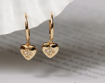 Gold Heart Charm Dangle Earrings featuring a delicate heart-shaped charm, crafted from 925 sterling silver with 18K gold plating, offering a stylish and elegant accessory for any occasion.