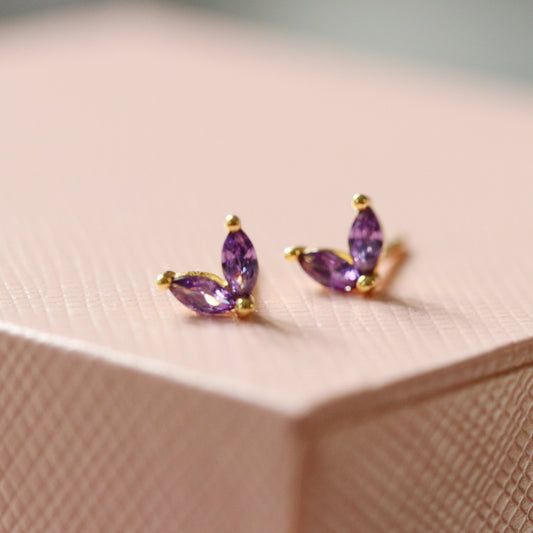  Shan&Co's Gold Lilac CZ Duo Marquise Earrings featuring marquise-cut crystal zirconia accents, crafted in gold vermeil with nature-inspired leaf and flower designs for an elegant look.