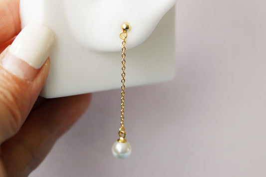 Close-up of Sterling Silver/Gold Vermeil Pearl Drop Chain Stud Earrings featuring a delicate chain with a single pearl drop, showcasing a minimalist and dainty design.