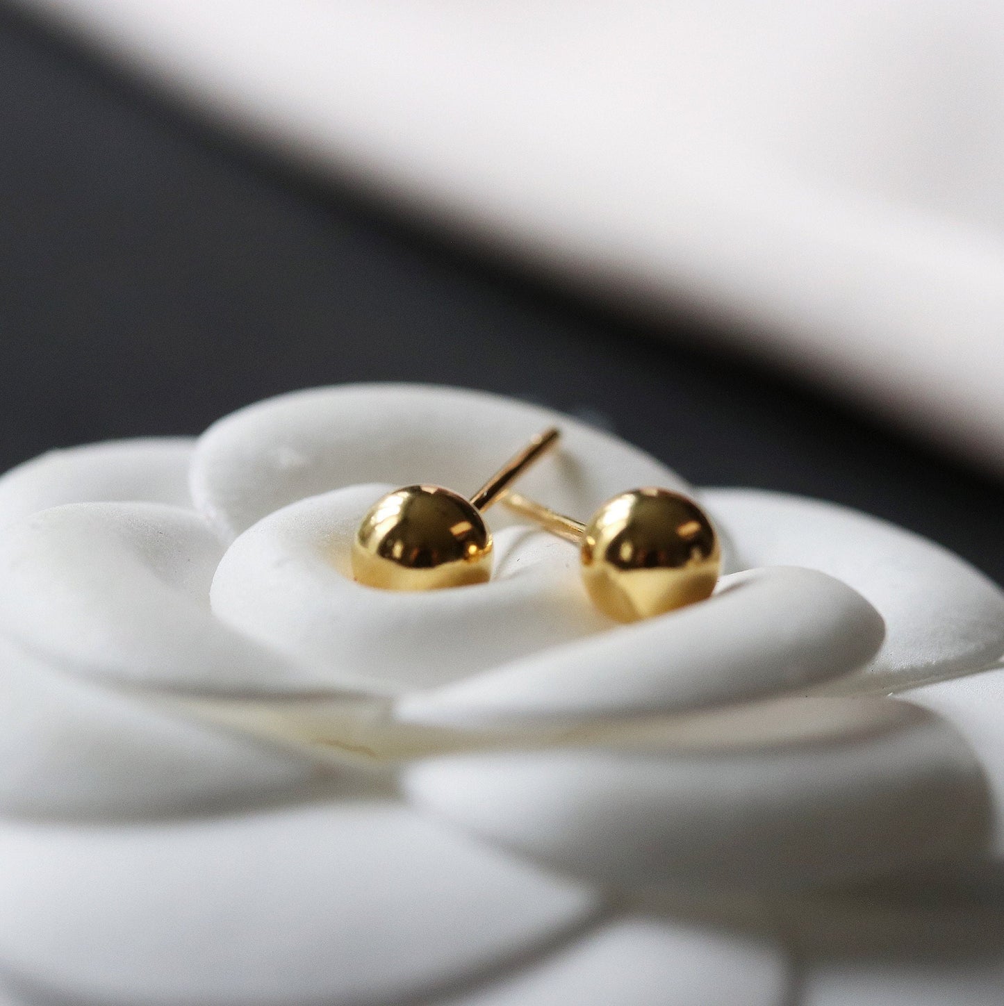 Shan&Co's Gold/Silver Tiny Ball Studs Earrings featuring a minimalist dot design, crafted from high-quality gold or silver, perfect for everyday wear and adding a subtle touch of elegance.