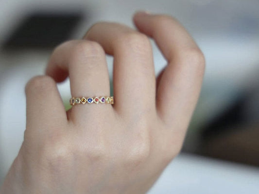 Gold Vermeil Rainbow Crystal Band Ring with multicolored crystals, adjustable vintage-inspired design, perfect for stacking or wearing solo.

