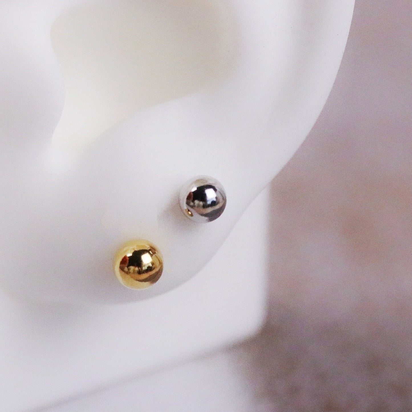 Shan&Co's Gold/Silver Tiny Ball Studs Earrings featuring a minimalist dot design, crafted from high-quality gold or silver, perfect for everyday wear and adding a subtle touch of elegance.