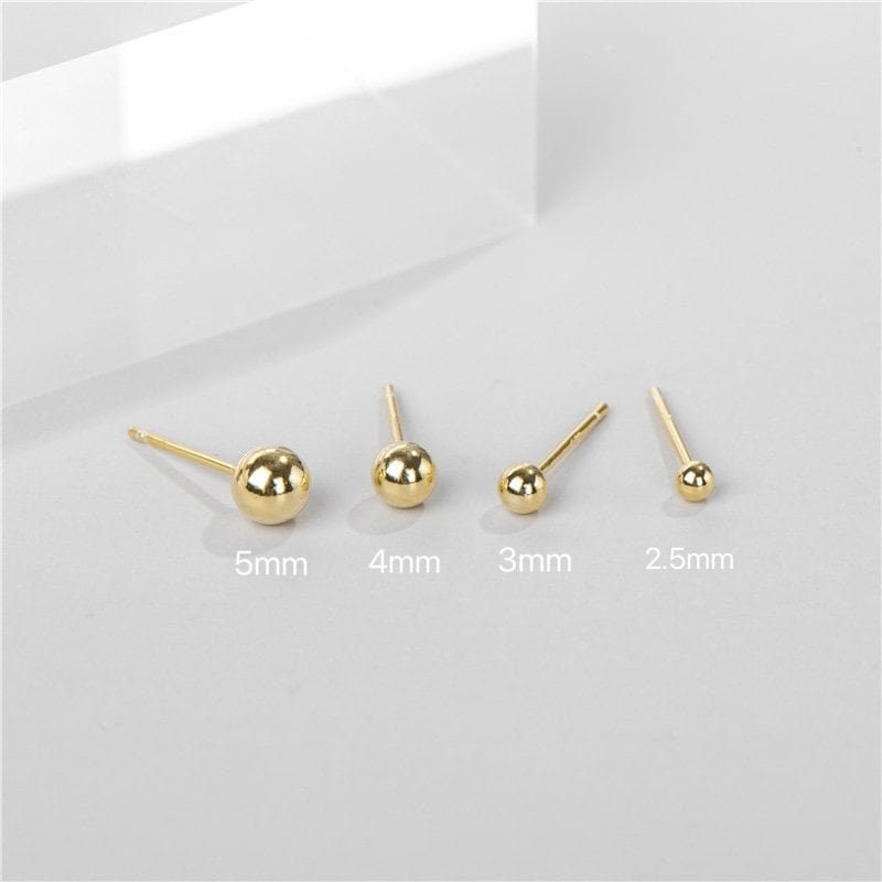 Shan&Co's Gold/Silver Tiny Ball Studs Earrings featuring a minimalist dot design, crafted from high-quality gold or silver, perfect for everyday wear and adding a subtle touch of elegance.