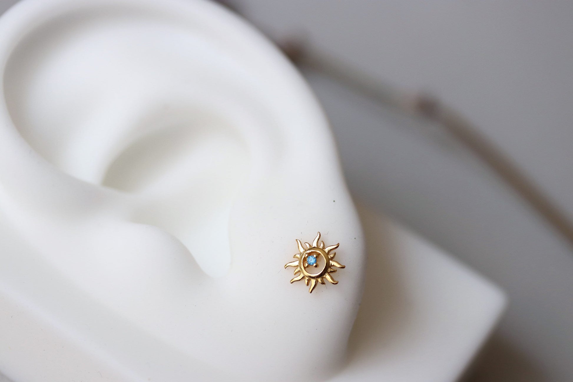 Shan&Co's Sterling Silver/Gold Vermeil Starburst Stud Earrings, featuring a radiant starburst design, paired with Blue Opal Sunburst Studs for a celestial-inspired look. Crafted in high-quality sterling silver or gold vermeil.