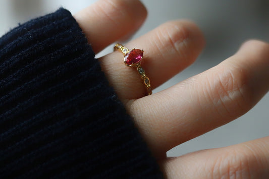 Gold Vermeil Marquise-Cut Ruby Ring with CZ Side Accents featuring a deep red marquise-cut gemstone and sparkling CZ accents. Elegant, lightweight, and perfect for adding subtle glamour to any look.