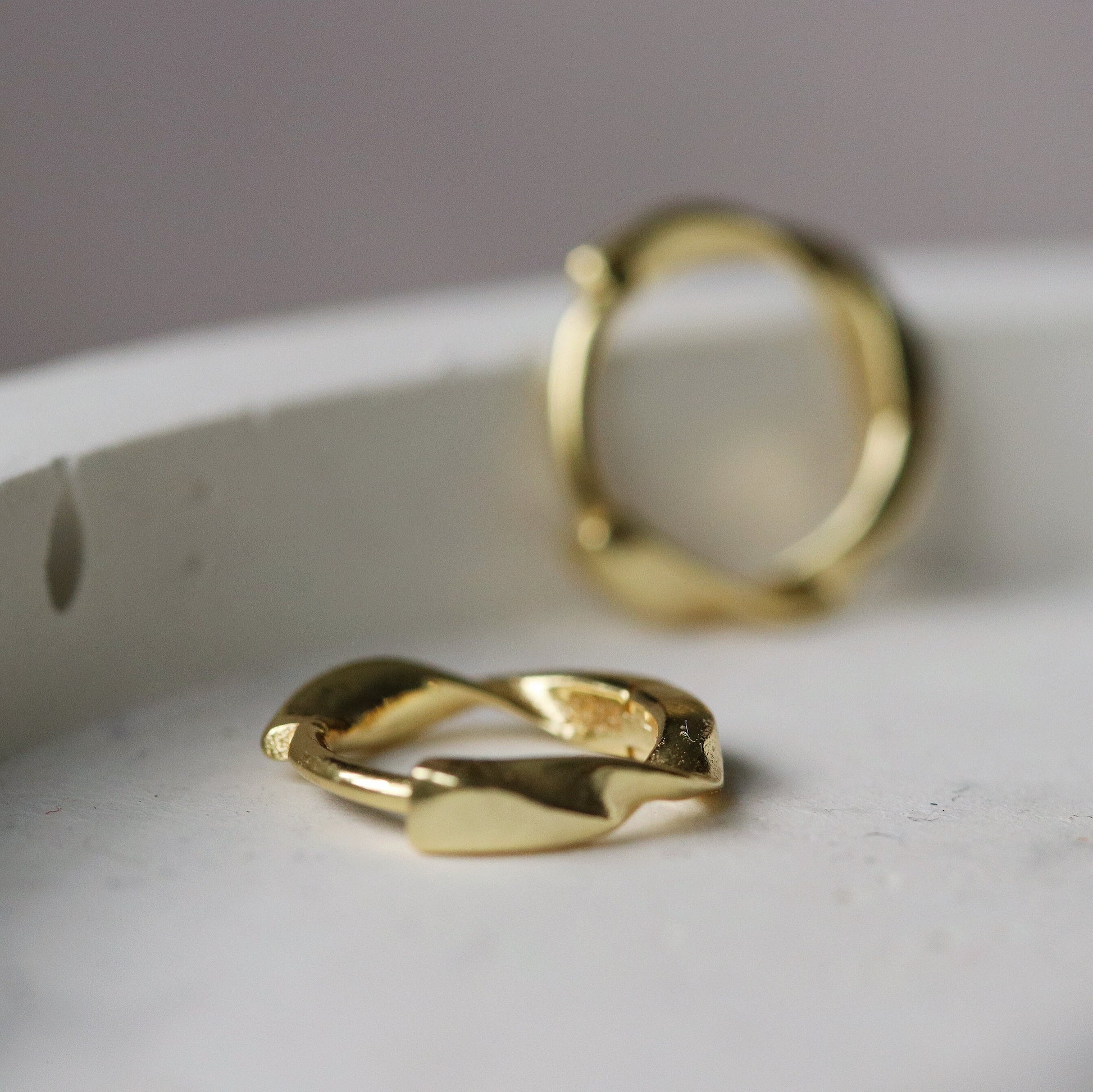 Shan&Co's Sterling Silver/Gold Vermeil Minimalist Twist Hoop Earrings featuring a sleek, subtle twist design, crafted from high-quality sterling silver or gold vermeil for a modern and sophisticated look.