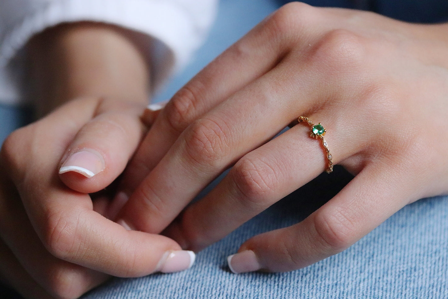 Gold Plated Emerald Ring featuring an adjustable band with a vibrant green cubic zirconia crystal, designed for stacking. A dainty and vintage-inspired piece that blends classic charm with modern versatility.