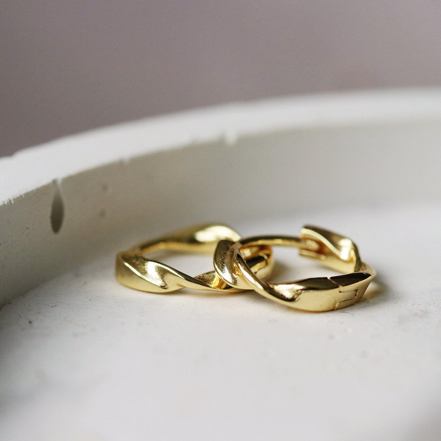 Shan&Co's Sterling Silver/Gold Vermeil Minimalist Twist Hoop Earrings featuring a sleek, subtle twist design, crafted from high-quality sterling silver or gold vermeil for a modern and sophisticated look.