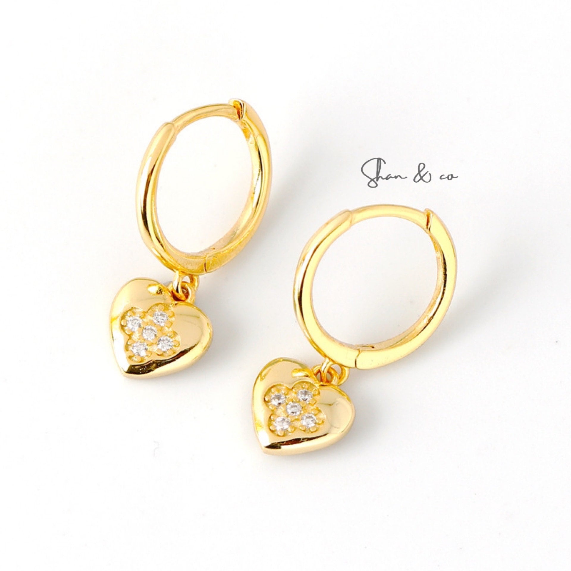 Gold Heart Charm Dangle Earrings featuring a delicate heart-shaped charm, crafted from 925 sterling silver with 18K gold plating, offering a stylish and elegant accessory for any occasion.