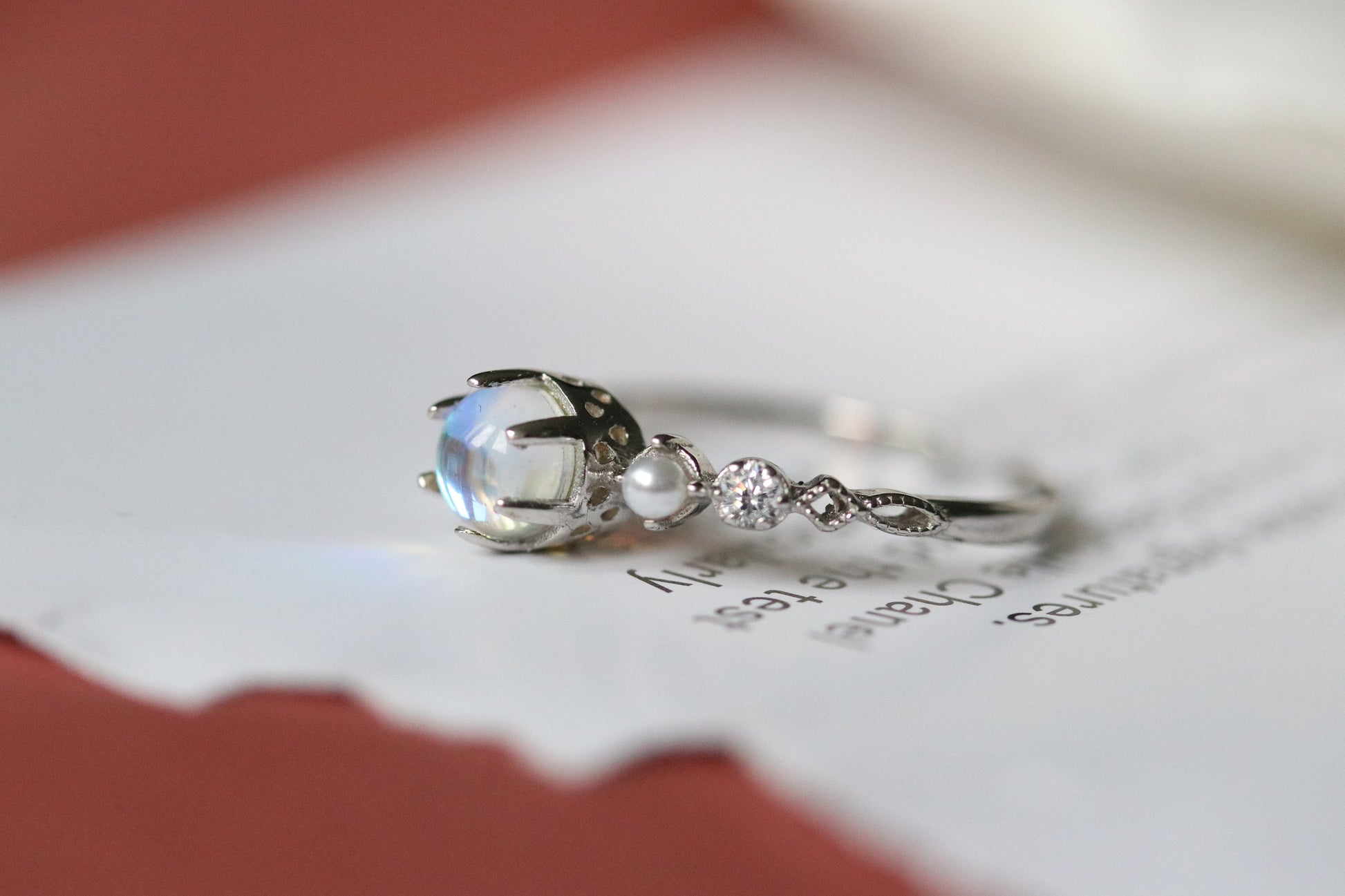 Sterling Silver Natural Moonstone Ring featuring a genuine moonstone center with a spectrum of shifting colors, set in a durable sterling silver band for a touch of elegance.