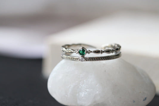 Sterling Silver/Gold Vermeil Twisted Band Ring with a vivid emerald accent, delicate vintage-inspired design, perfect for stacking.