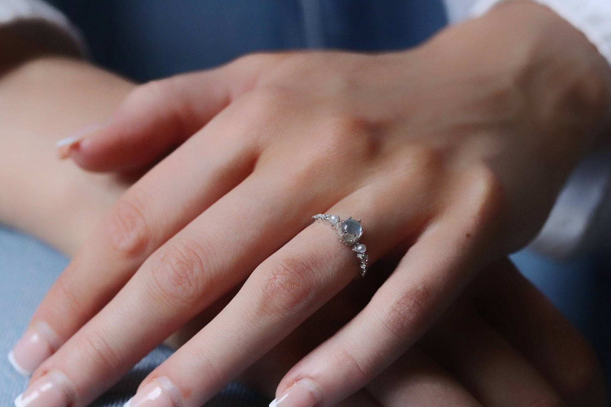 Sterling Silver Natural Moonstone Ring featuring a genuine moonstone center with a spectrum of shifting colors, set in a durable sterling silver band for a touch of elegance.