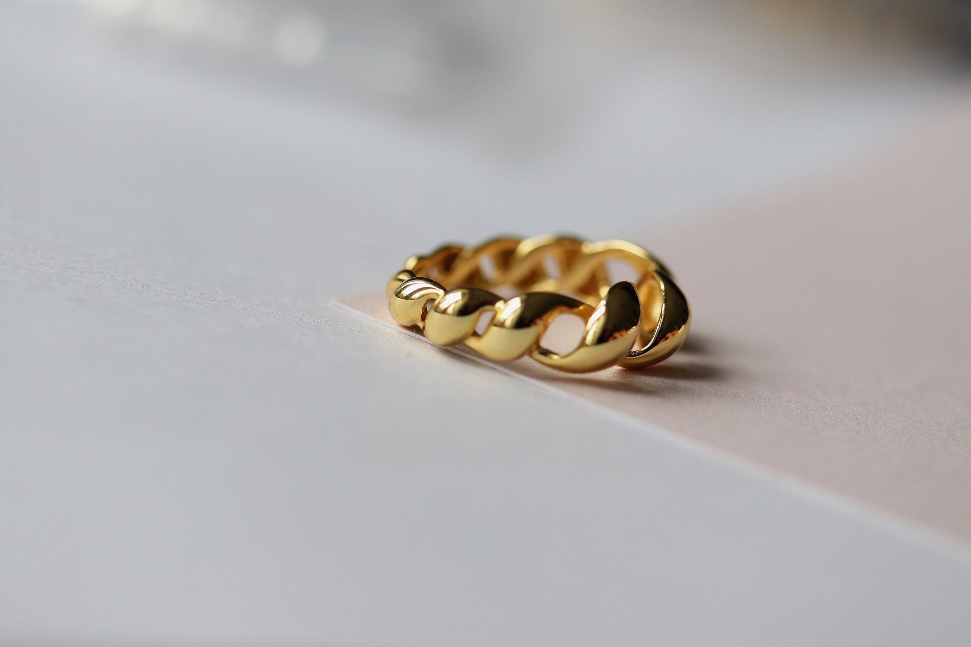 Gold vermeil chunky dome ring with a twisted croissant-inspired design, perfect as a bold statement piece.