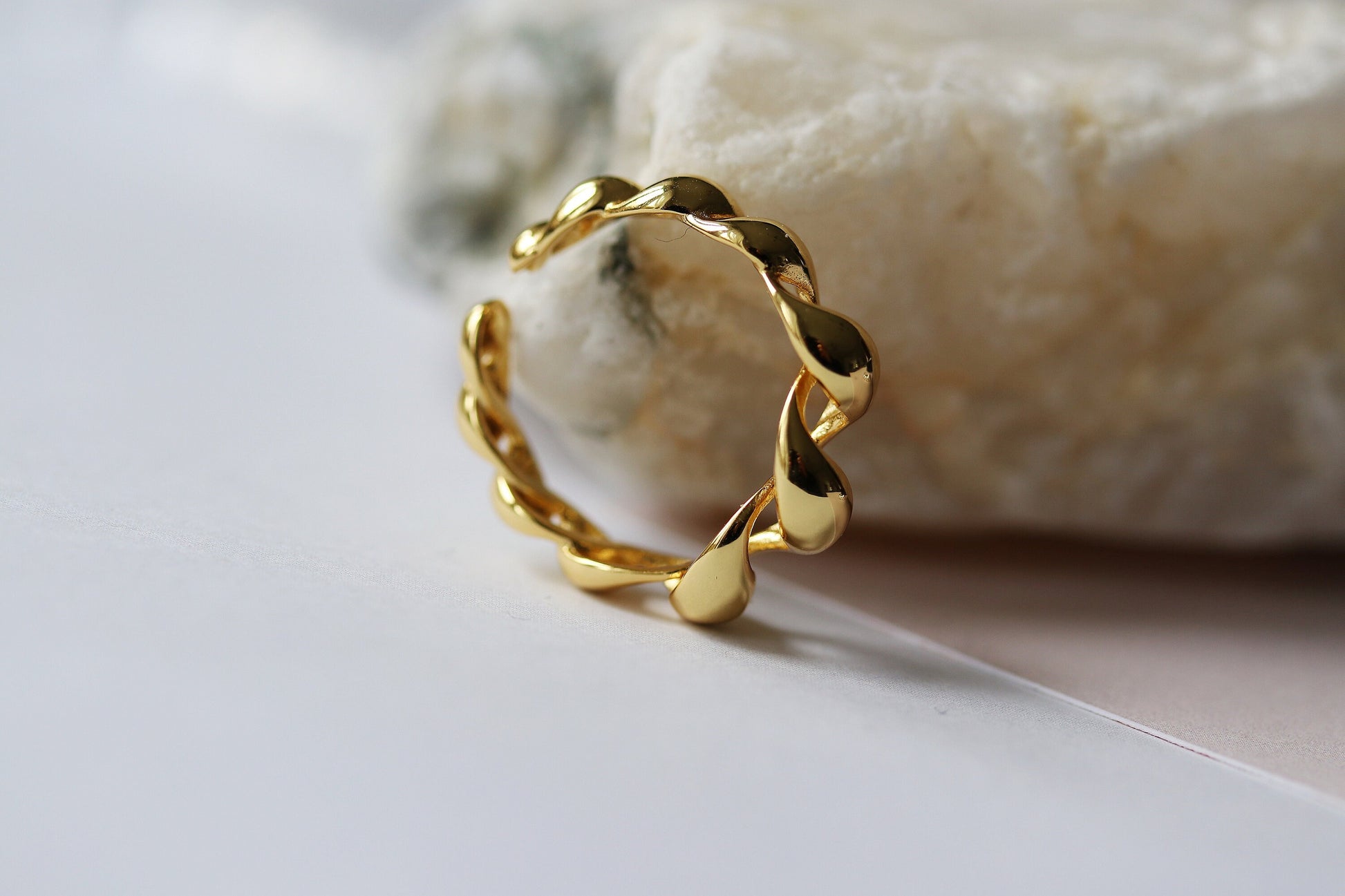 Gold vermeil chunky dome ring with a twisted croissant-inspired design, perfect as a bold statement piece.