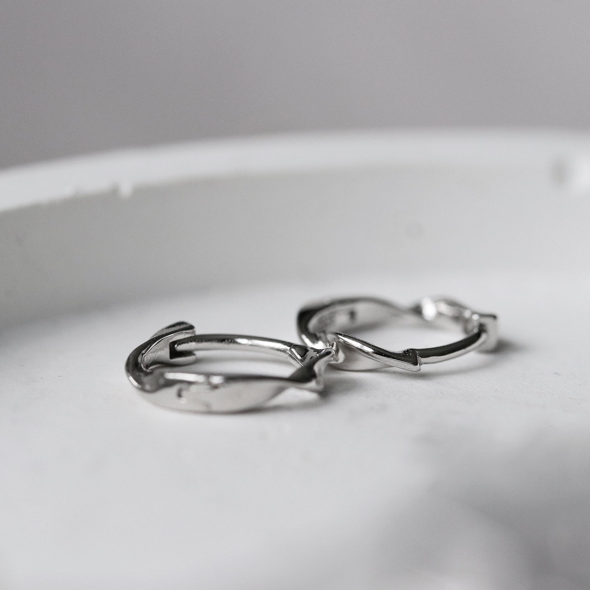 Shan&Co's Sterling Silver/Gold Vermeil Minimalist Twist Hoop Earrings featuring a sleek, subtle twist design, crafted from high-quality sterling silver or gold vermeil for a modern and sophisticated look.